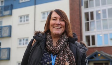 Housing Officer outside homes