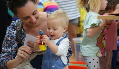 Resident with child looking at toys