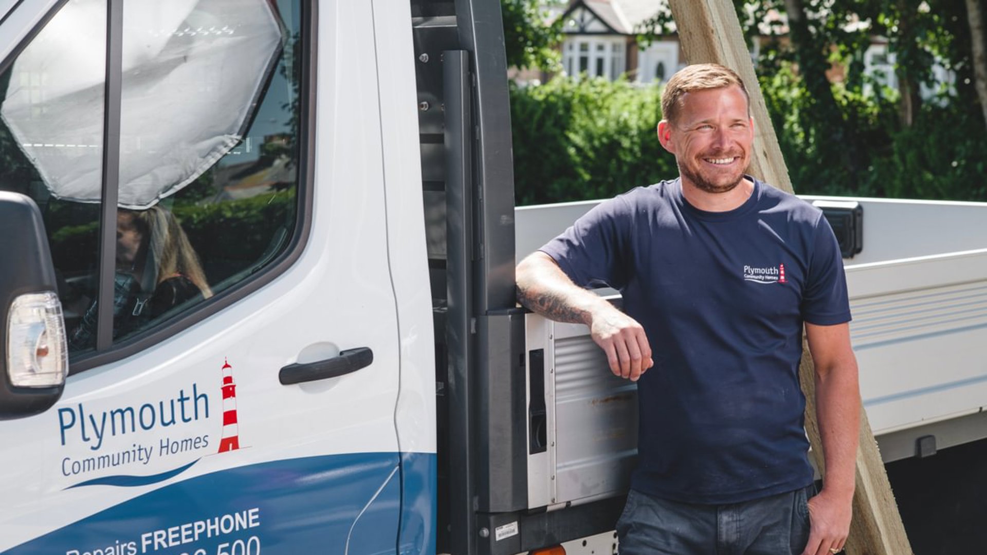 Repairs Staff Infront Of Vehicle