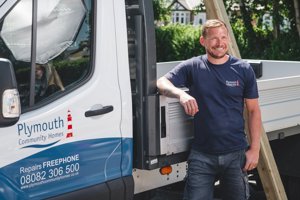 Repairs Staff Infront Of Vehicle