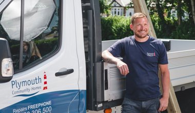 Repairs Staff Infront Of Vehicle