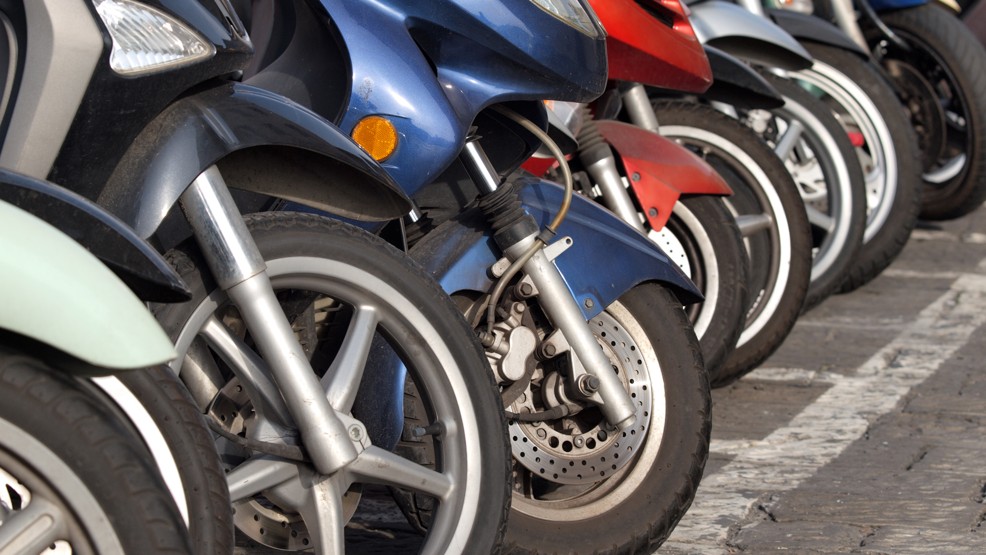 Row Of Parked Mopeds