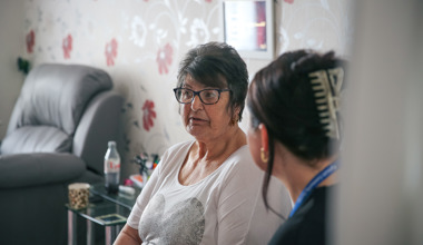 Resident chatting to member of staff
